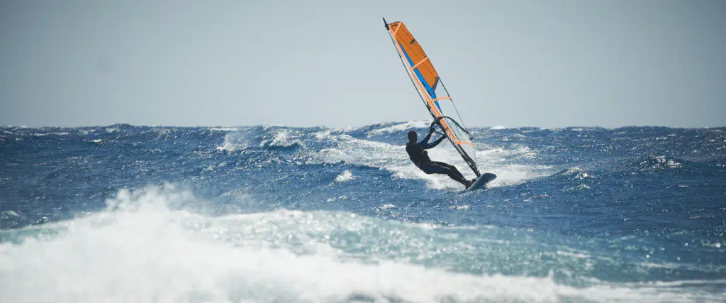 A person windsurfing off the coast of Cabo San Lucas