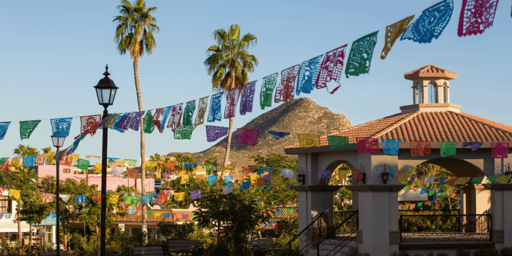 A public plaza in Cabo San Lucas with a mountain in the background