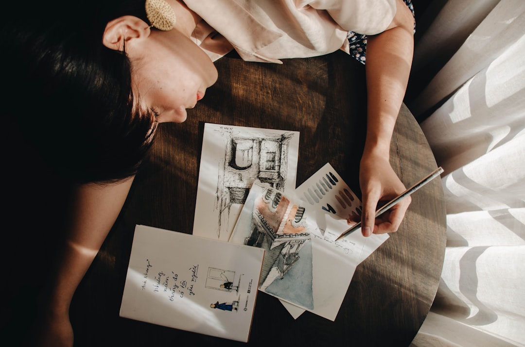 A professional realtor or home inspector carefully examining a construction detail on the wall of a bright, modern home, representing due diligence on a property tour.